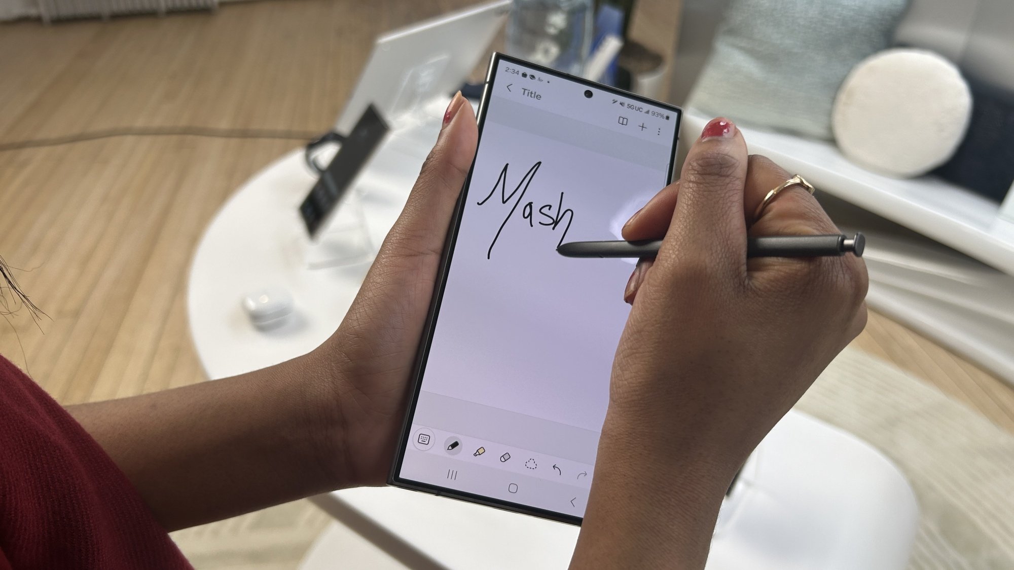 Woman writing on Samsung Galaxy S24 Ultra with S Pen